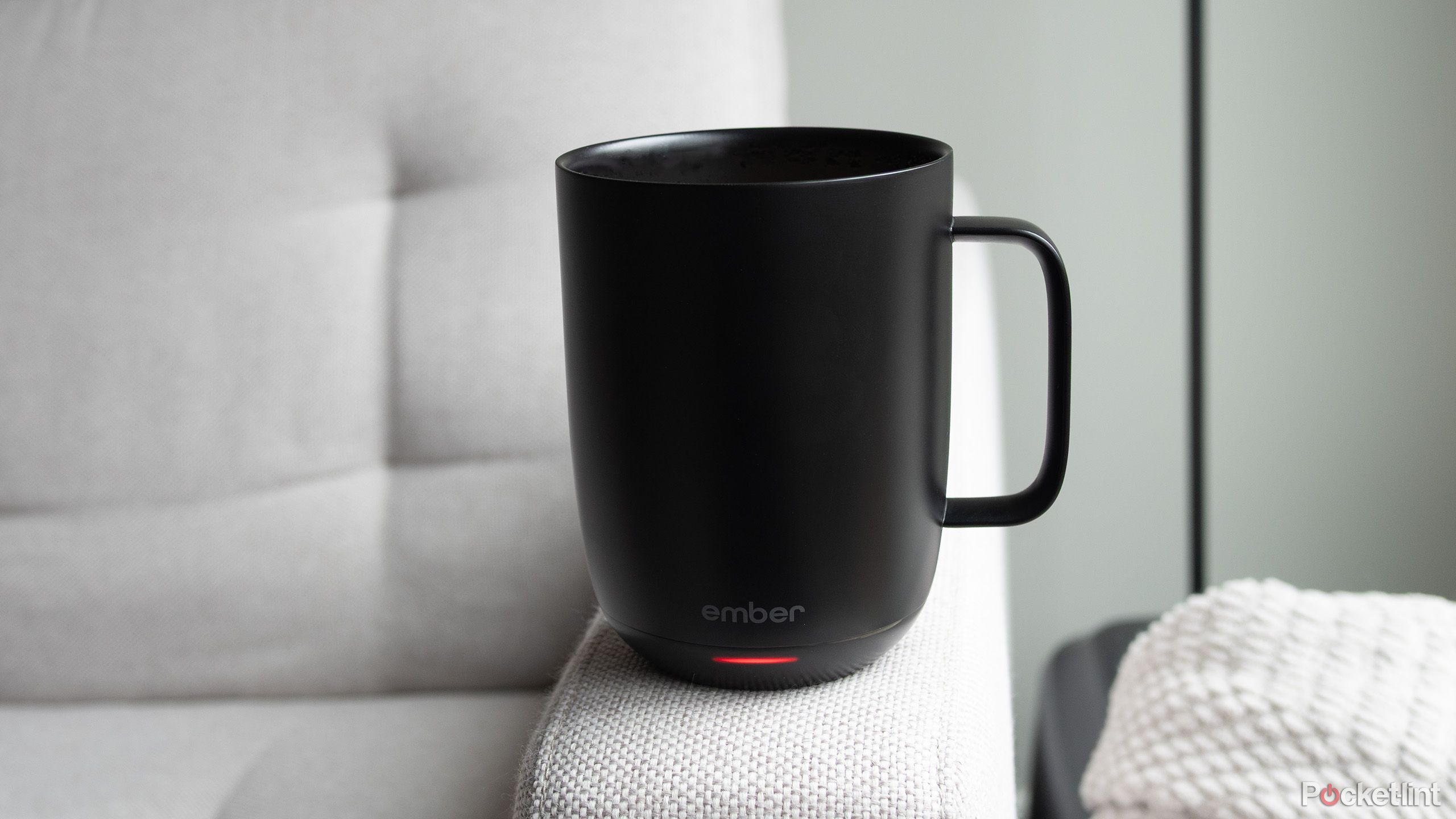 Ember Mug 2 on couch arm