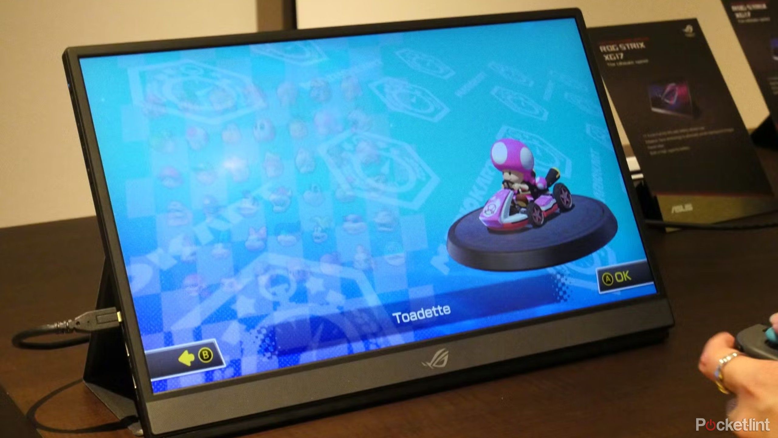 Portable monitor featuring mario kart. 