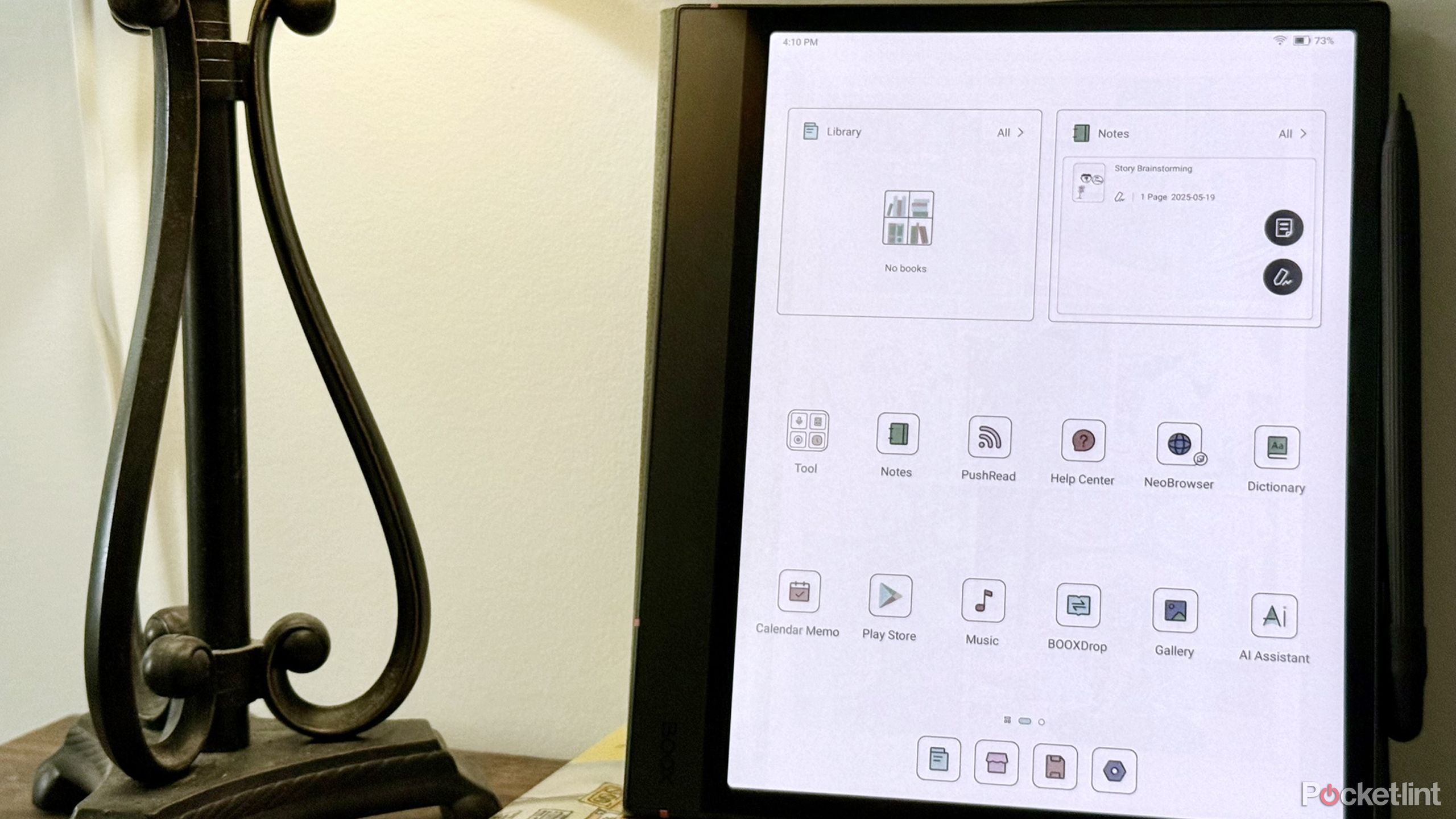 The Boox Note Air4C next to a lamp.