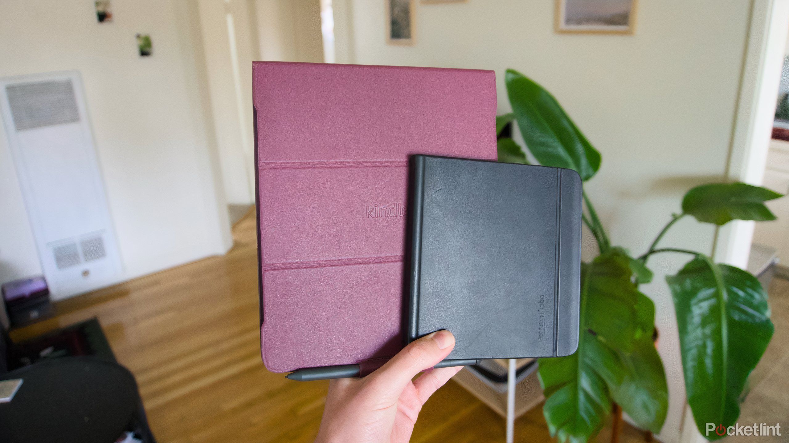 A Kobo Libra Colour in a case on top of a Kindle Scribe in a case.