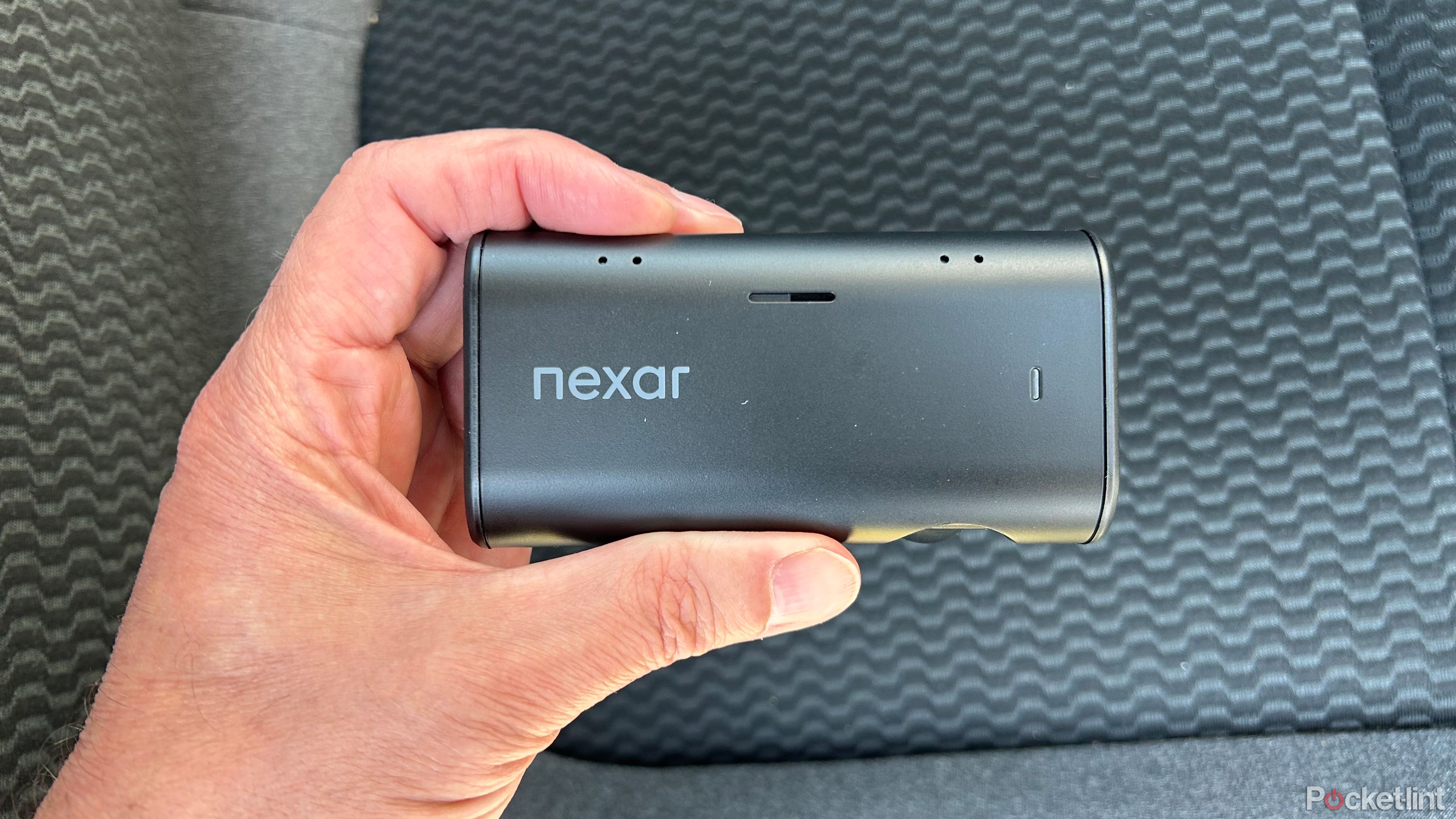 Nexar Beam2 Mini Dash Cam in hand from the side. 