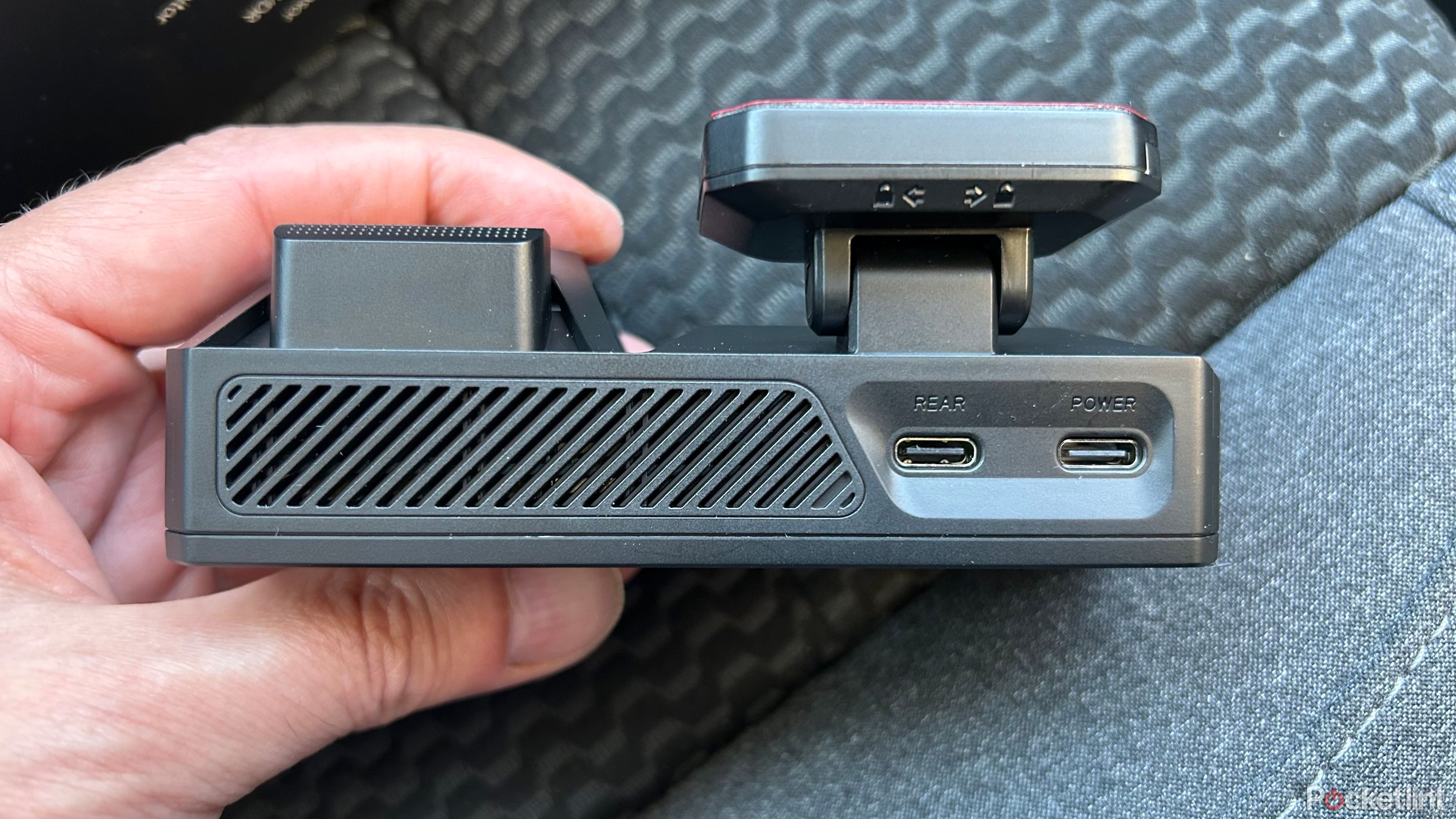 Redtiger F77 Dash Cam in hand from the top. 
