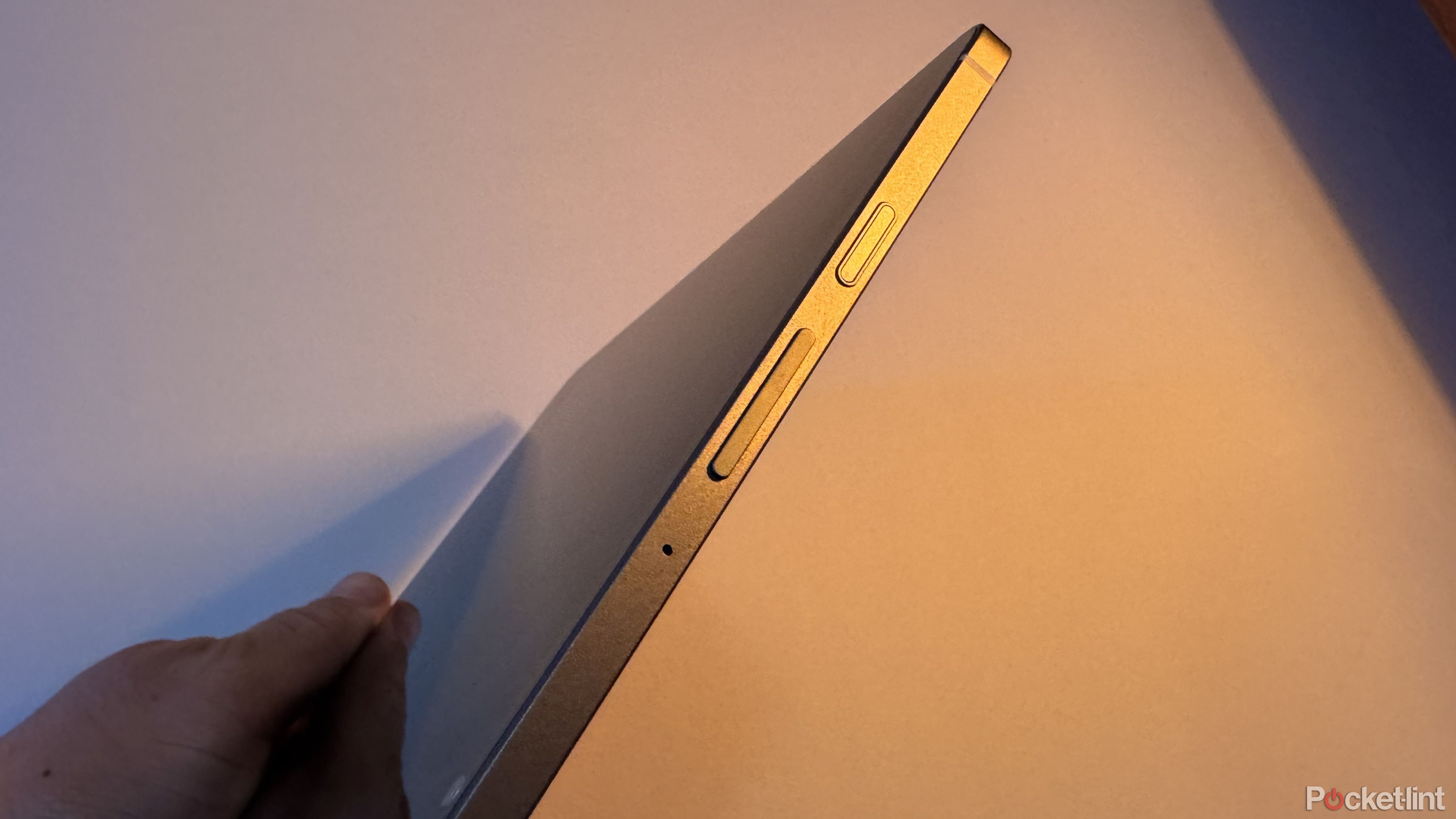 An image of the Samsung Galaxy Tab S10 FE highlighting its fingerprint scanner.