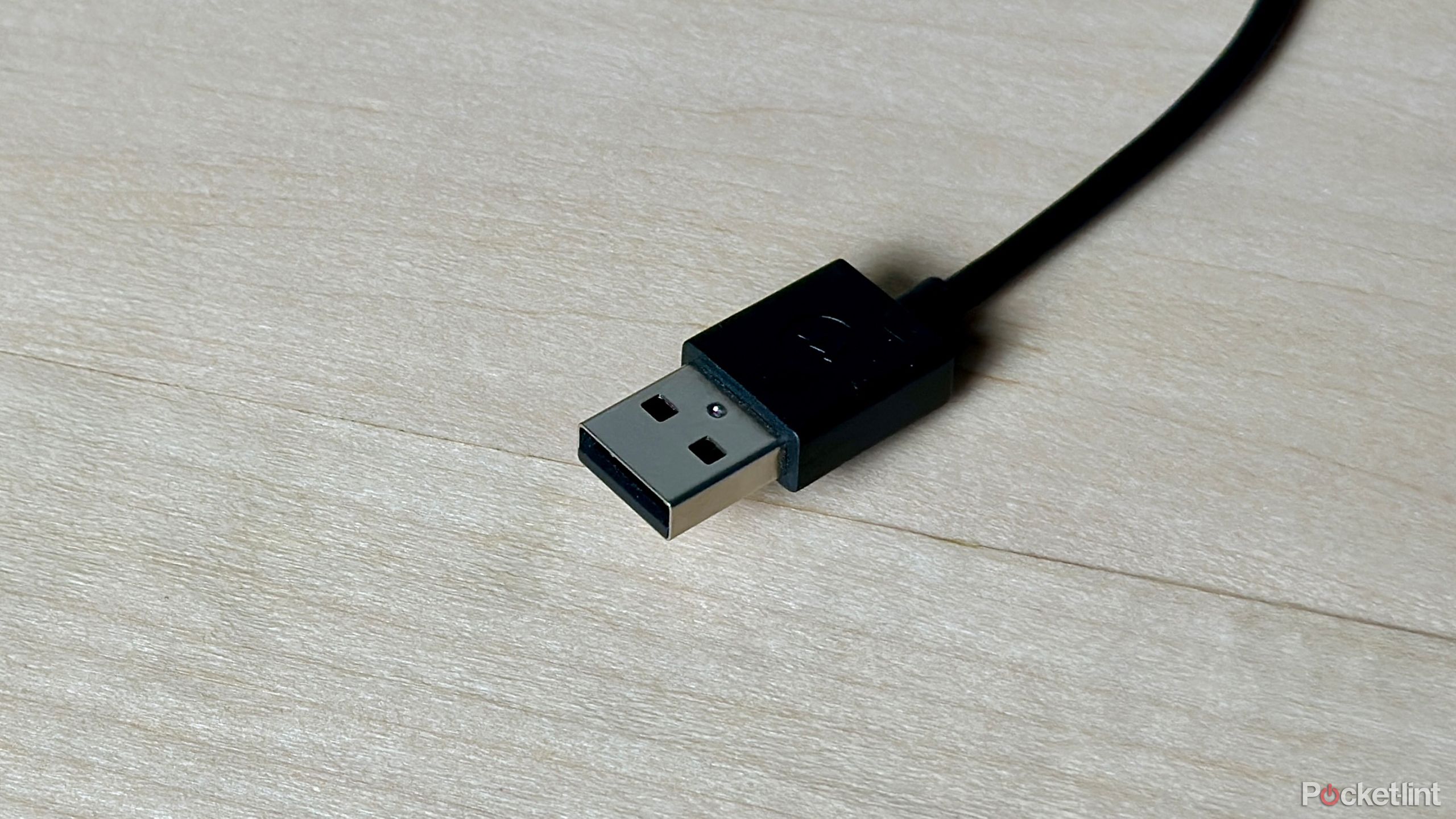 USB Type-A cable on desk.