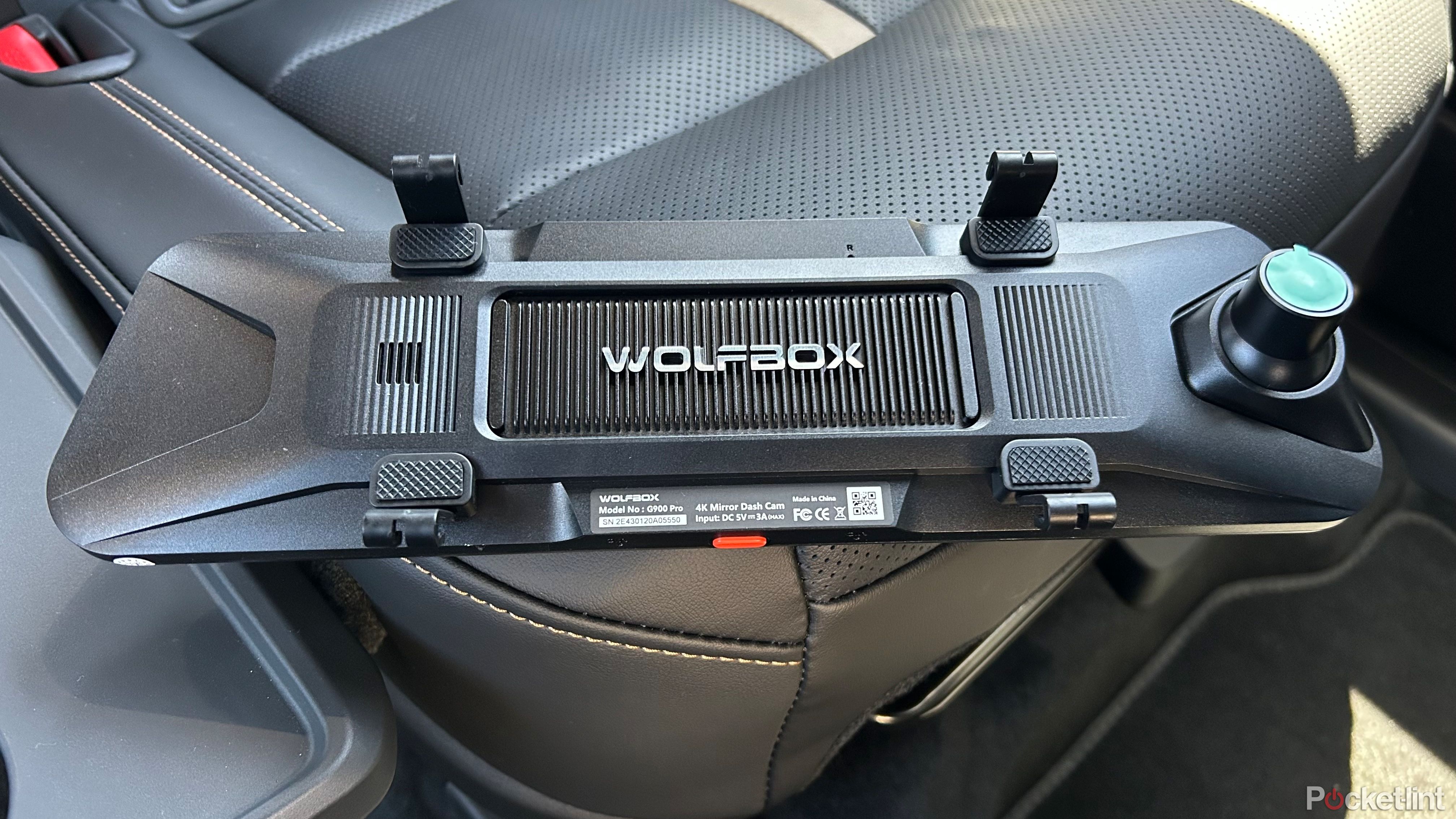 Wolfbox G900 Pro sitting on a car seat. 