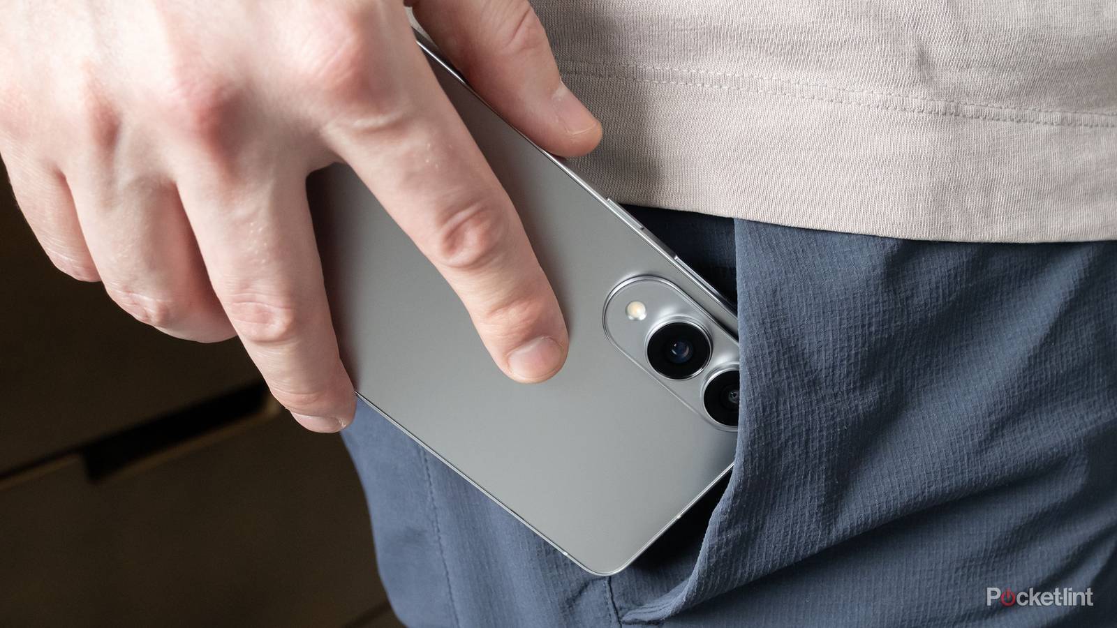 The Galaxy S25 Edge sliding into a shorts pocket.