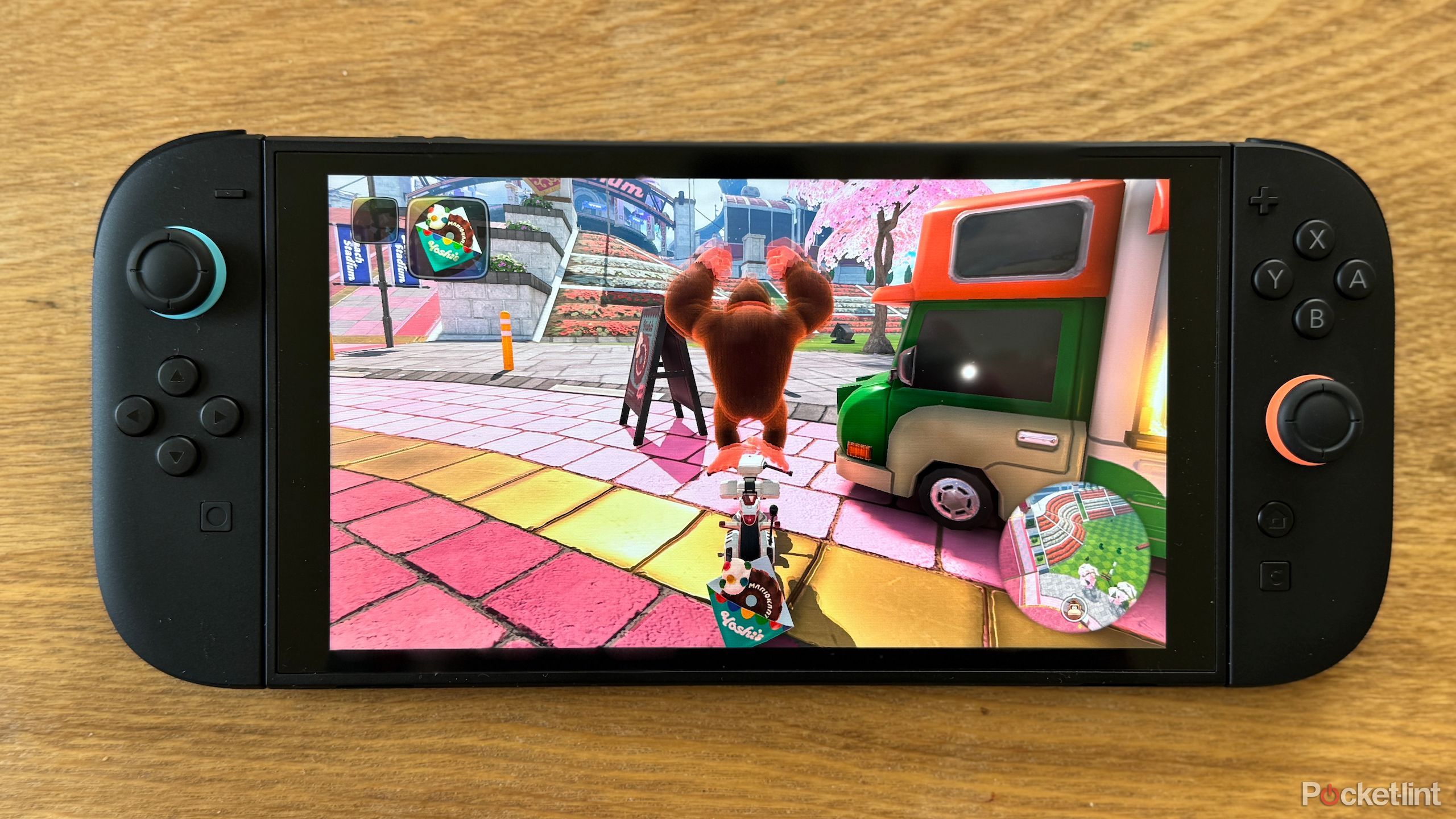A Nintendo Switch 2 flat on a table running Mario Kart World.