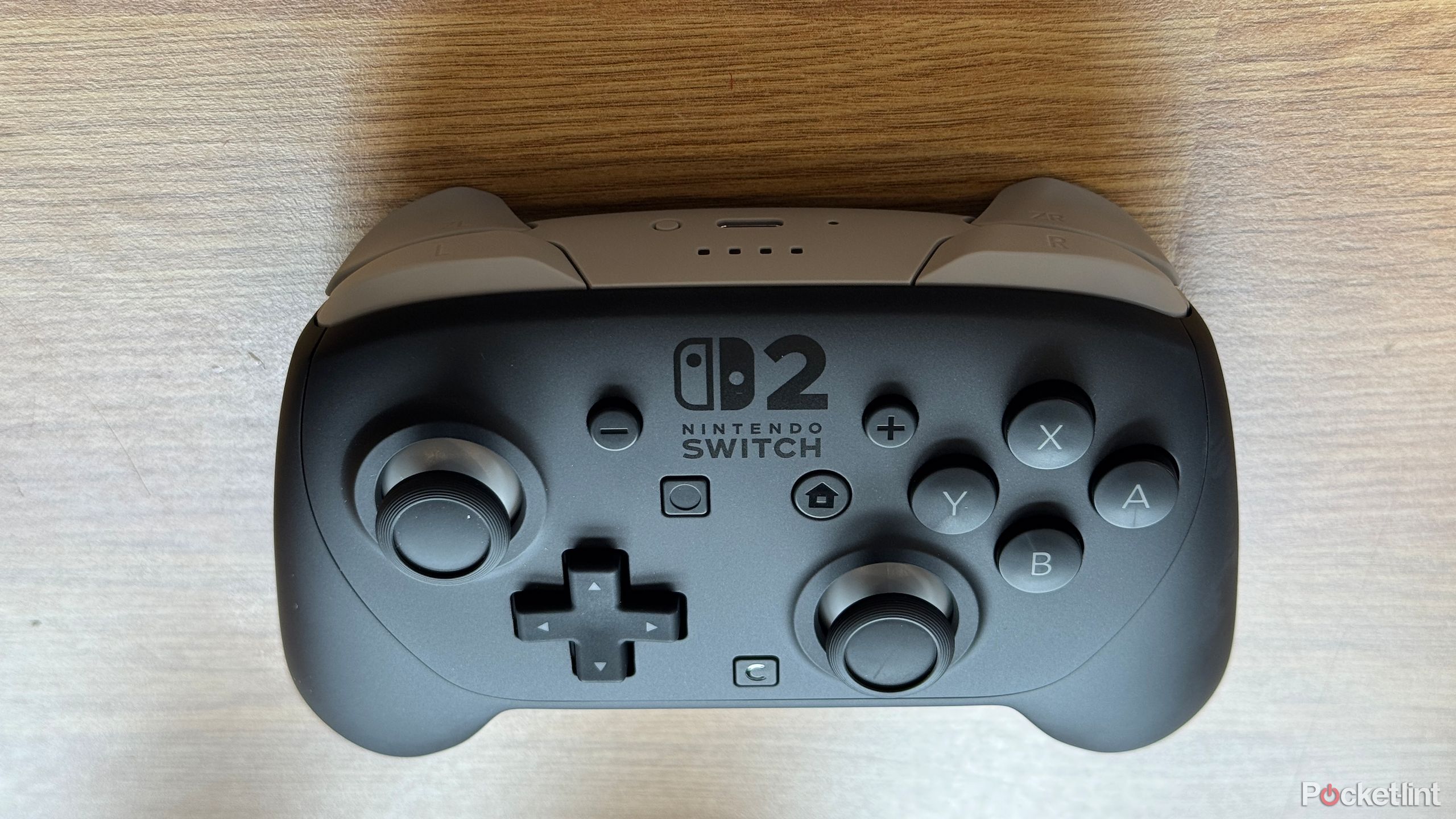A Nintendo Switch 2 Pro Controller showing the light gray rear.
