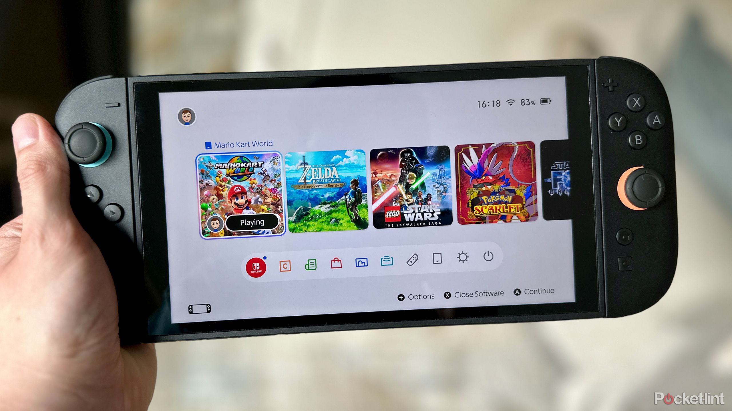 Nintendo Switch 2 in hand.