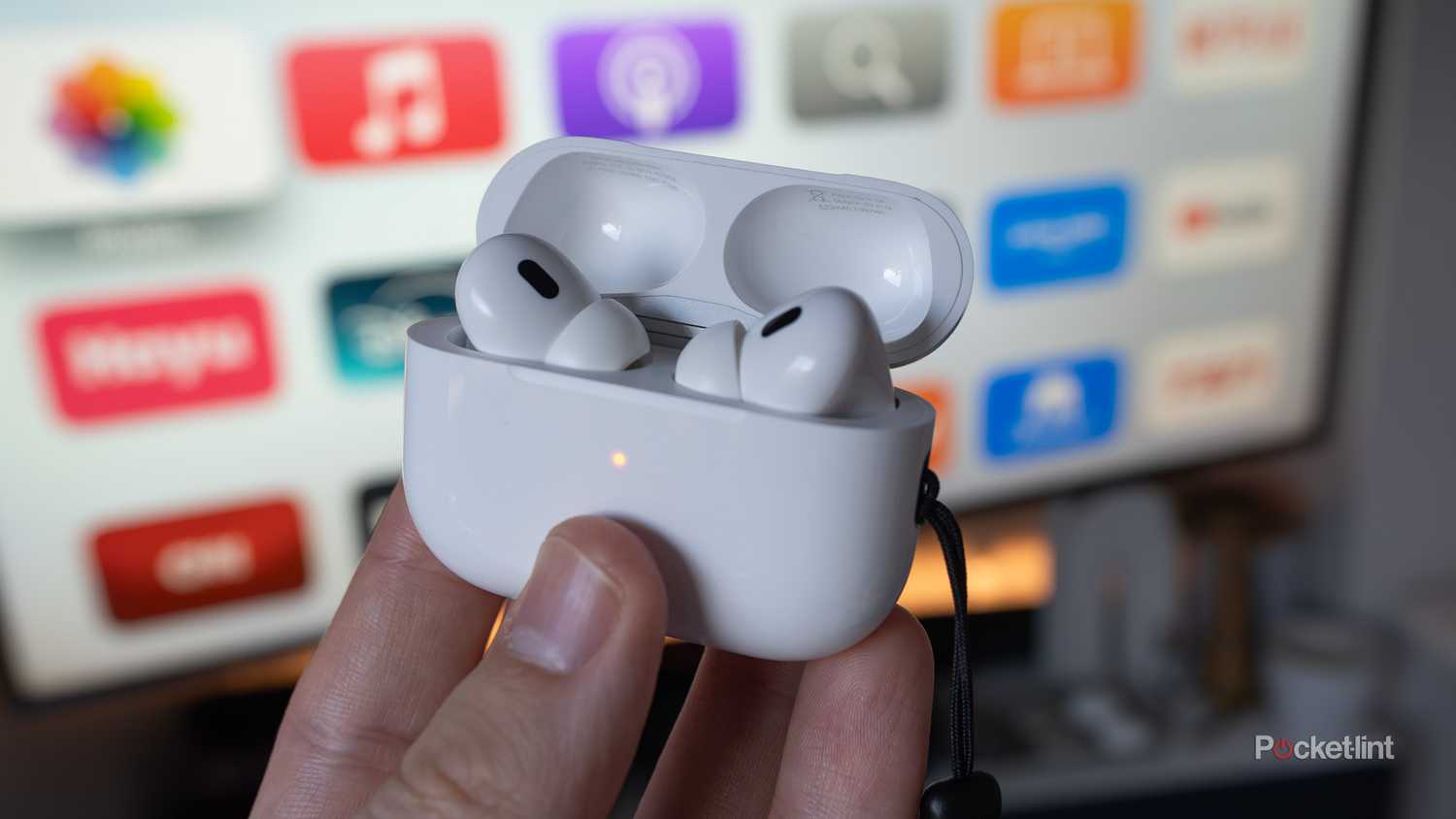 AirPods Pro 2nd-gen in front of a TV