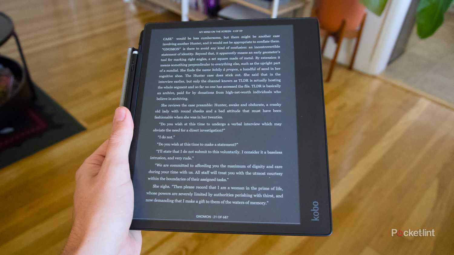 A Kobo Elipsa 2E displaying a book in Dark Mode, with black and white inverted.