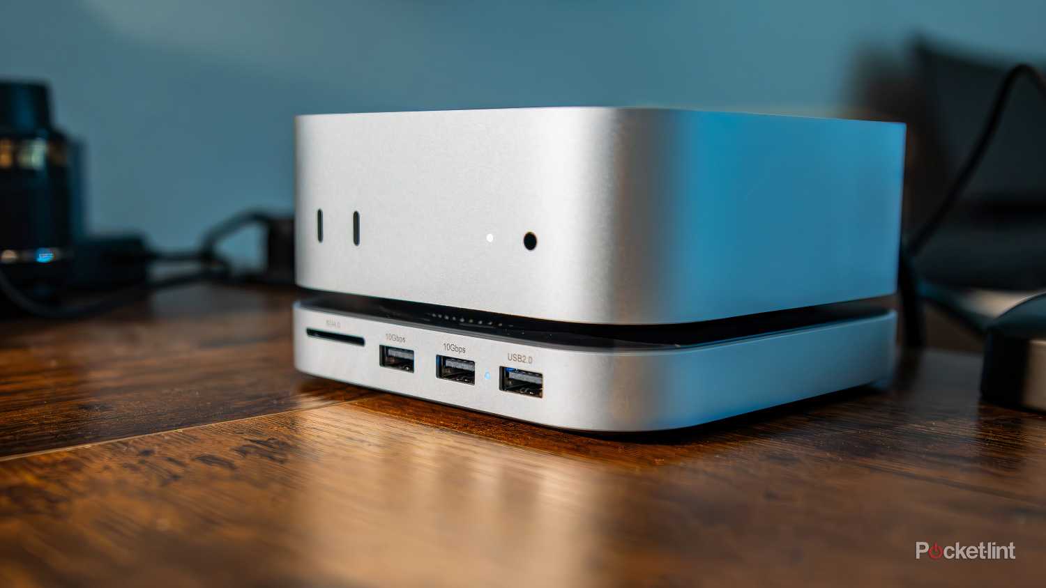 A still photo of the Satechi Mac Mini M4 SSD enclosure mounted underneath a Mac Mini. 