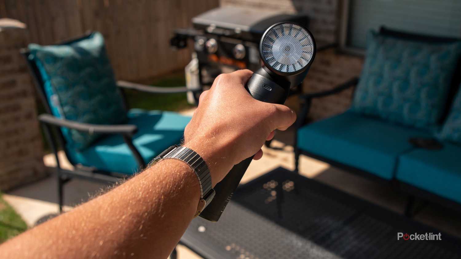 A still photo of the Hedgehog JET pointed at a back patio seating area. 