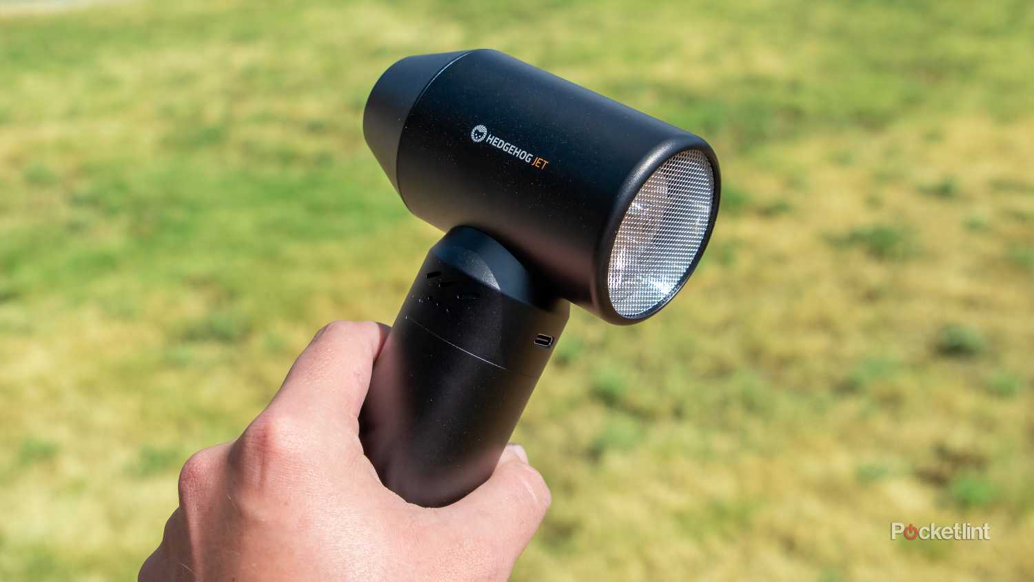 A still photo of the Hedgehog JET being held and pointed to the left.