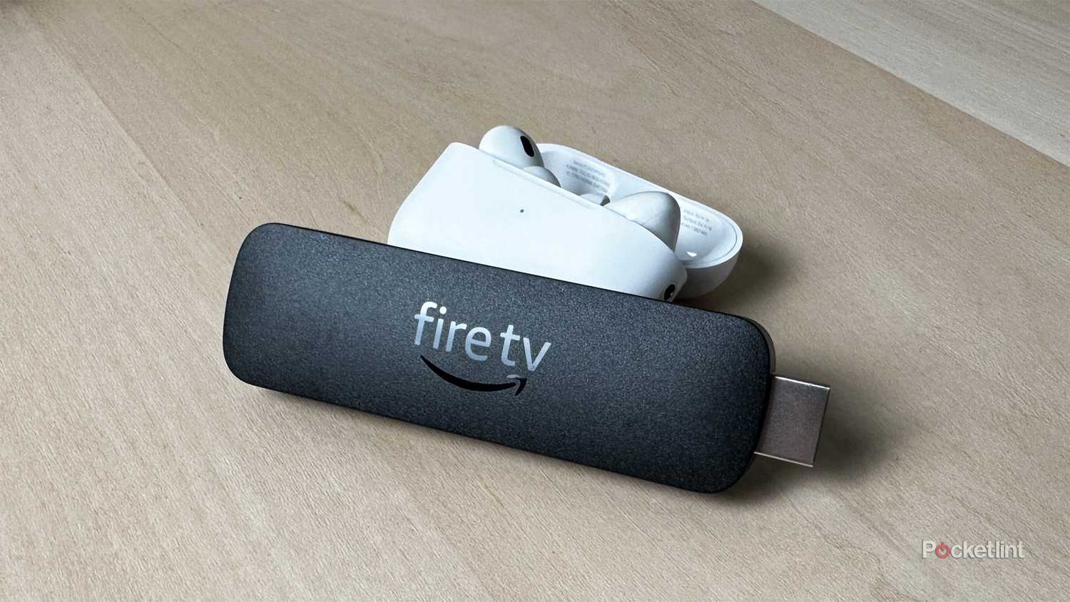 Fire TV Stick next to Apple AirPods.