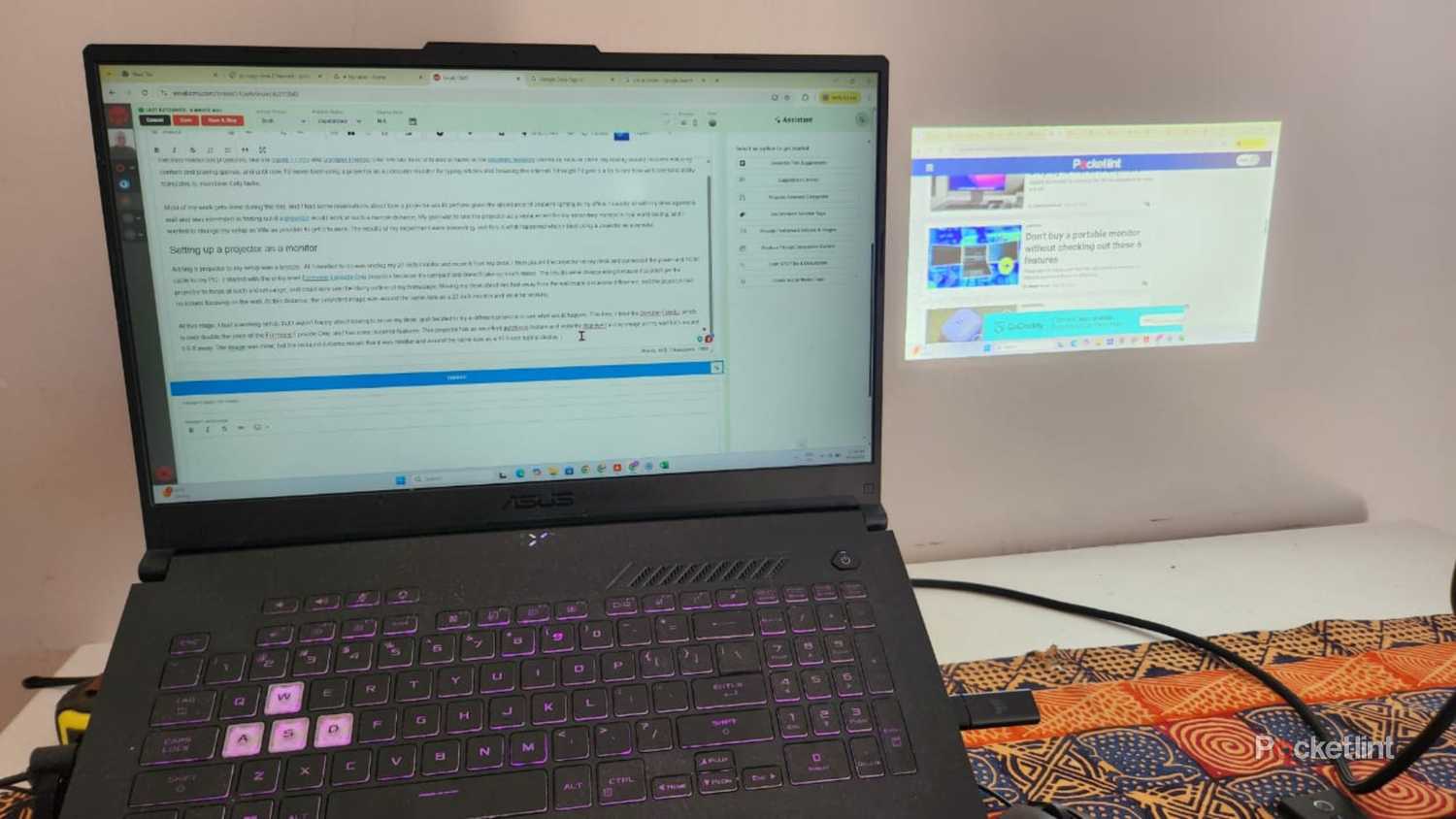 Laptop and Dangbei Projector on a desk.