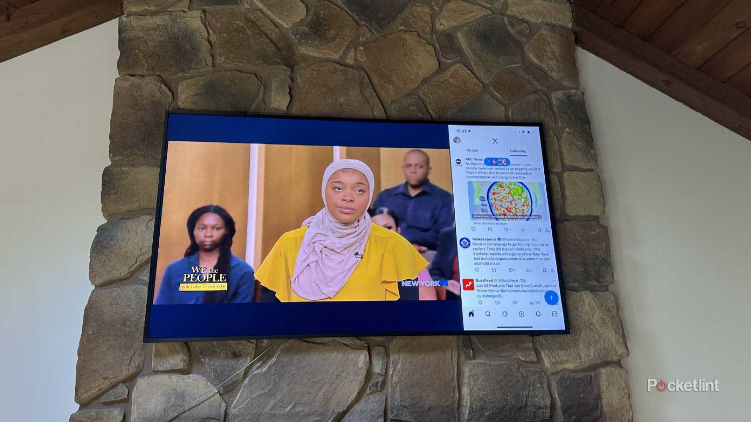 An iPhone screen mirrored on a smart TV along with a show